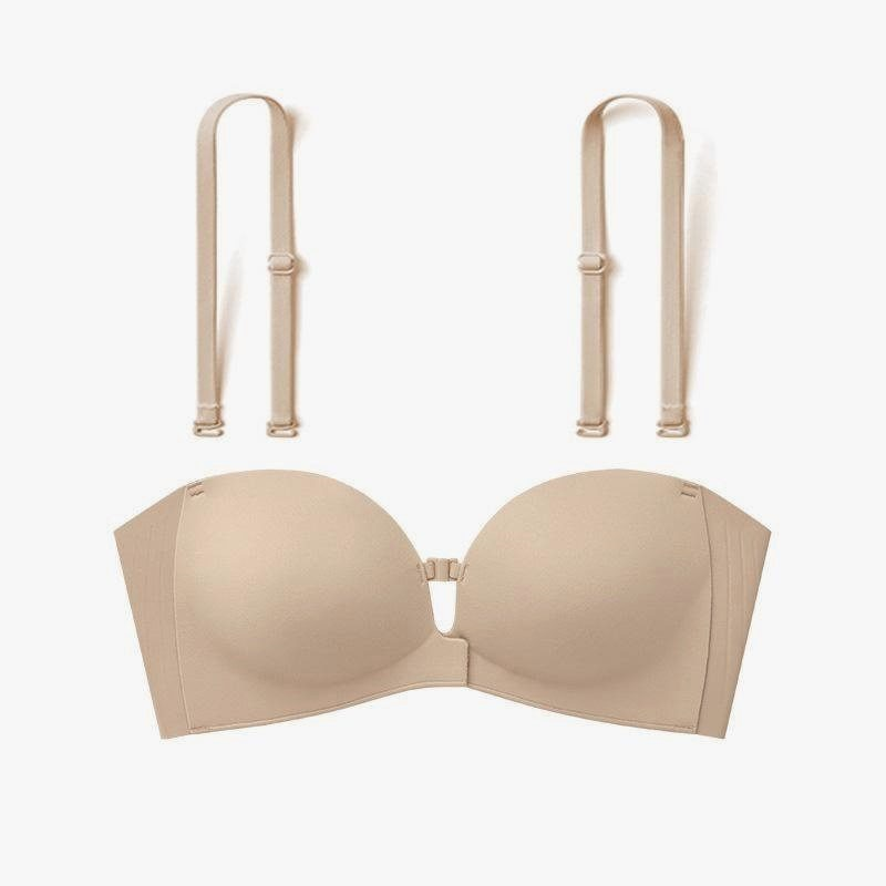 Beige bra and matching suspenders on a white background