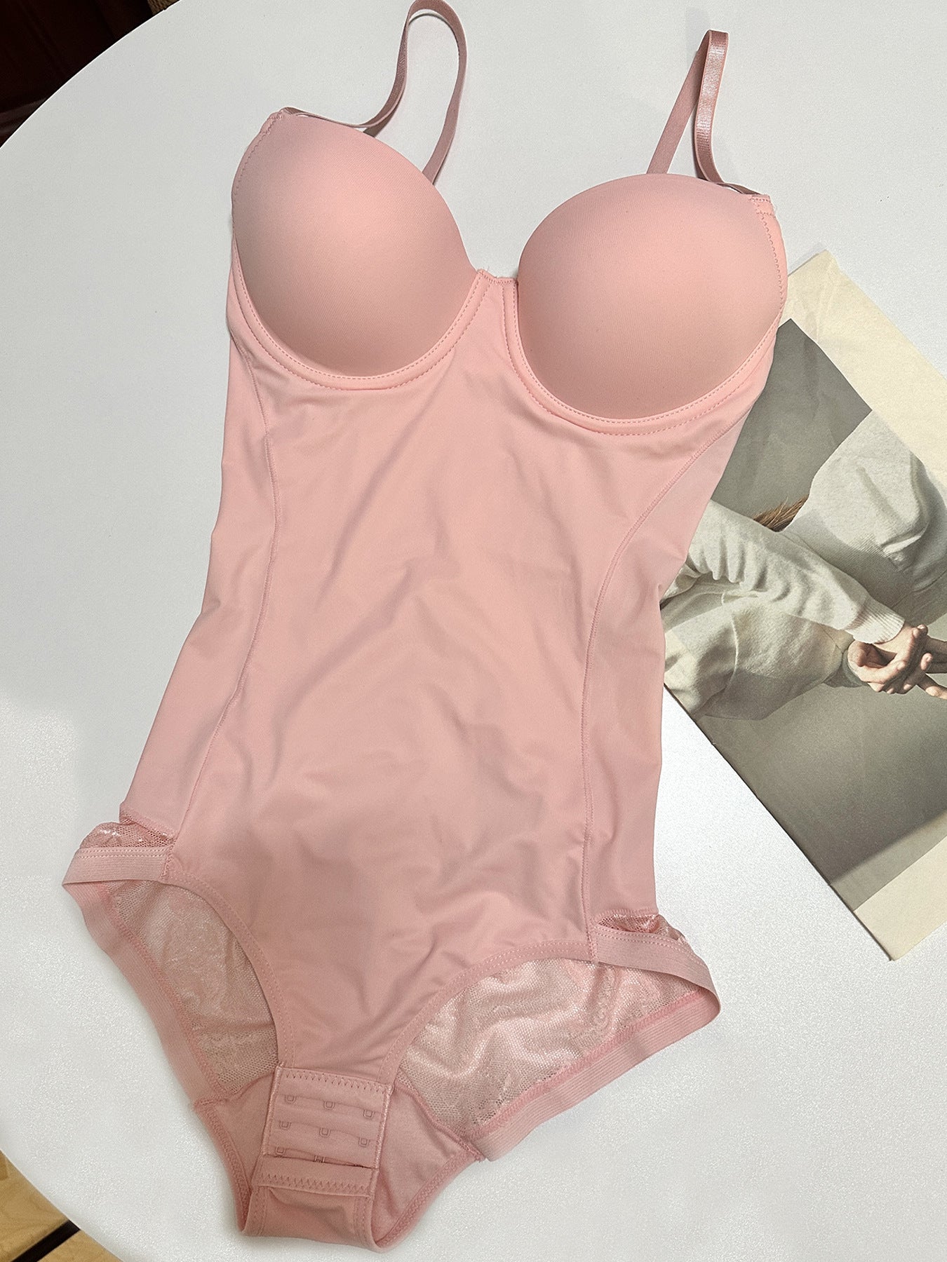 Fashion Couture seamless shapewear bodysuit with built-in bra, tummy control, and butt lift for smooth, flattering silhouette.