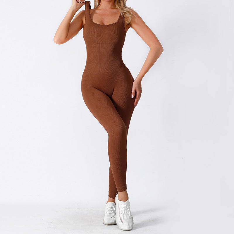 Fashion Couture seamless yoga jumpsuit, moisture-wicking one-piece activewear, shown in a sleek, fitted design for workout comfort.