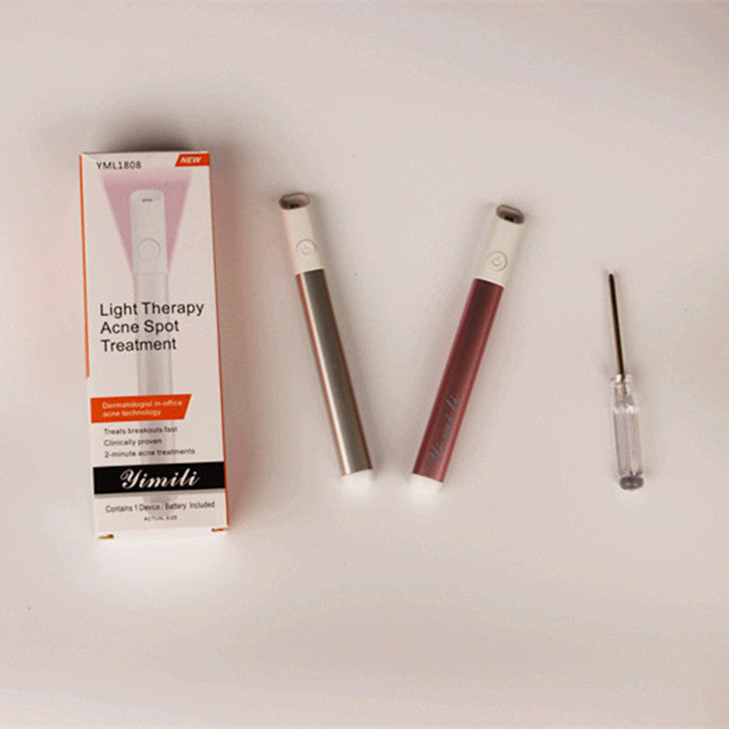 Fashion Couture LED acne treatment pen with red and blue light therapy for clearer skin, shown in close-up shot.