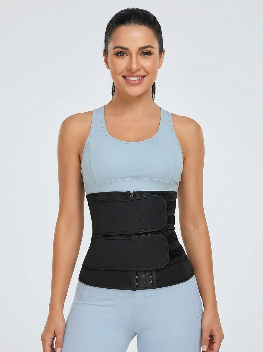 Fashion Couture women's black neoprene waist trainer shapewear, adjustable for a snug, comfortable fit on the model.