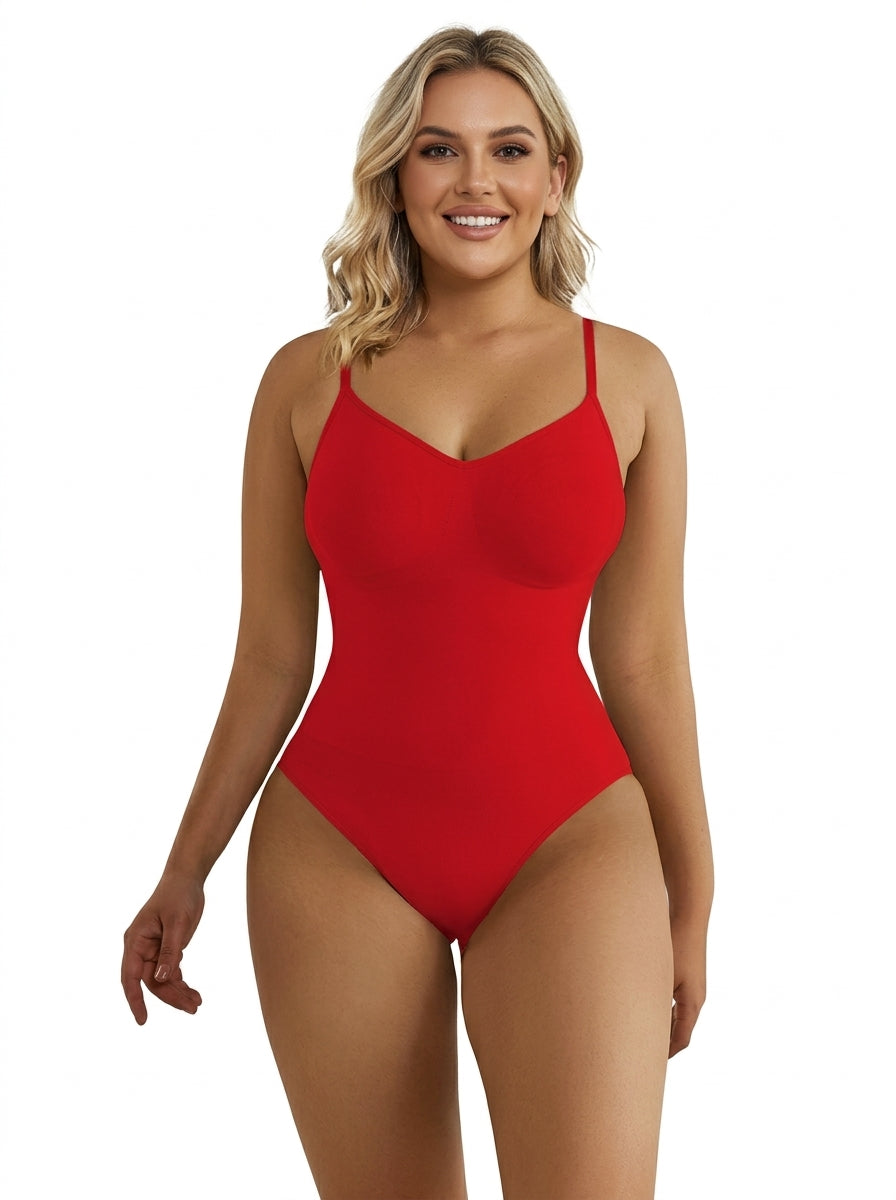 Fashion Couture tummy control shapewear bodysuit with butt lift, thong style, worn by smiling model in front view.