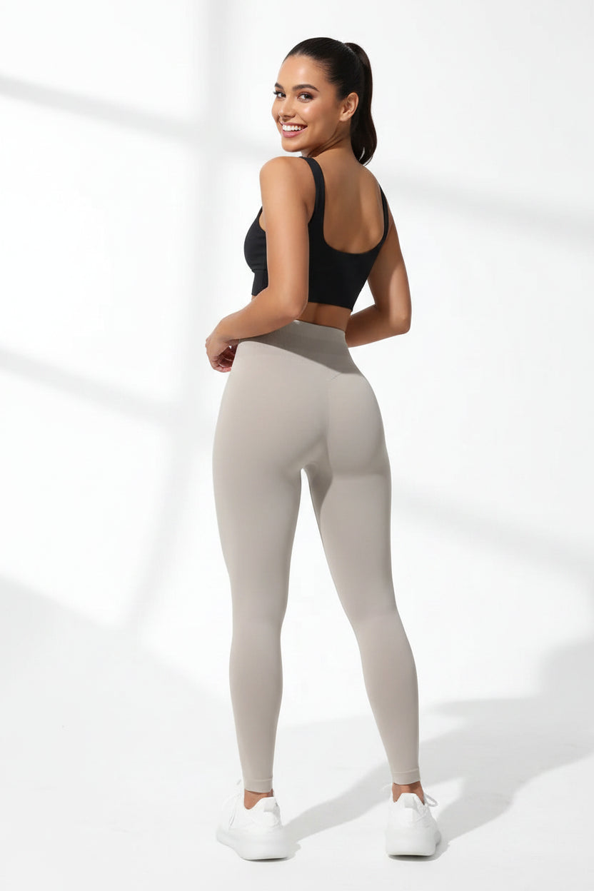 High-waist seamless yoga leggings by Fashion Couture, featuring butt lifting and tummy control, shown on a model in activewear.