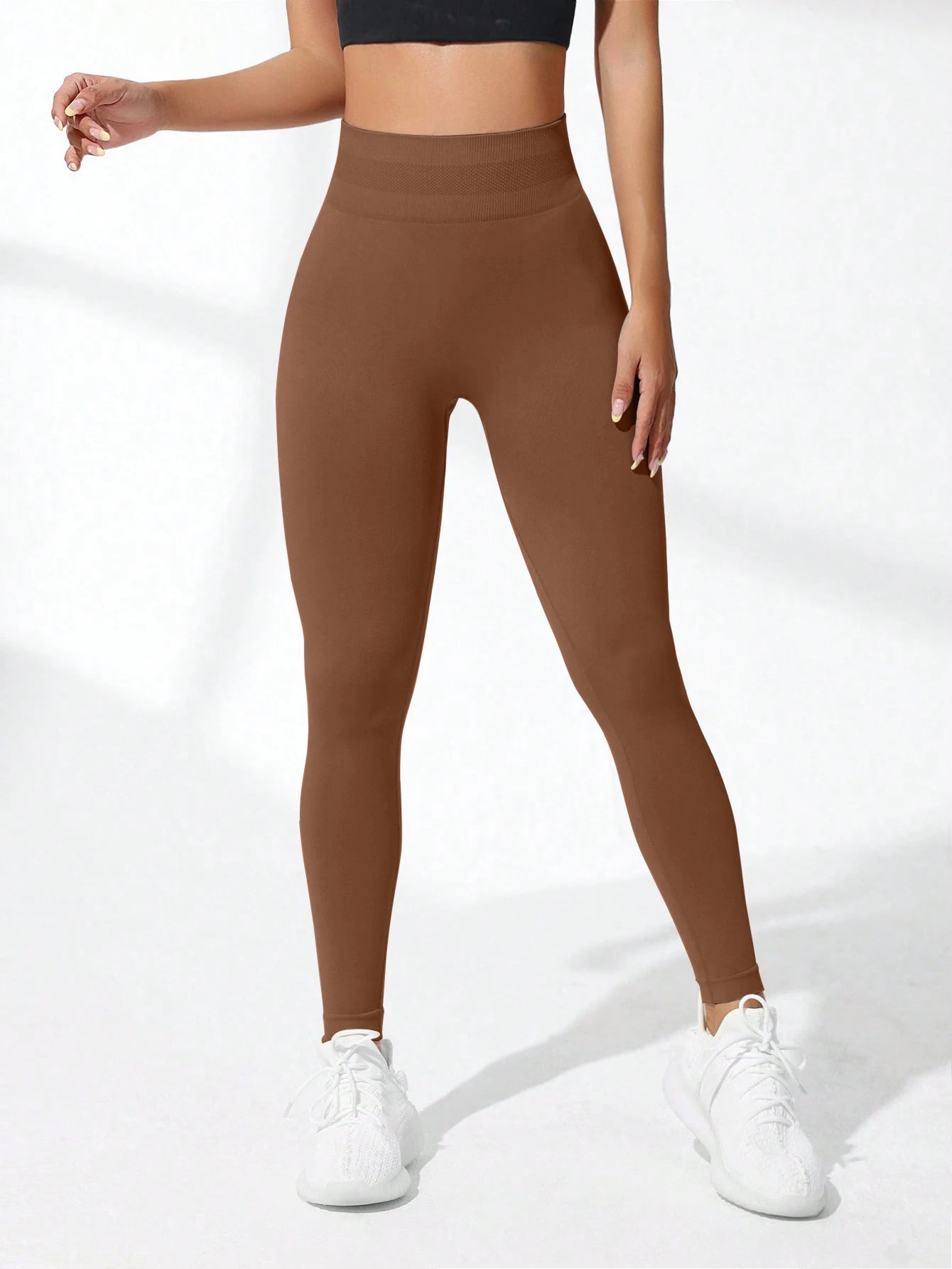 High-waist seamless yoga leggings from Fashion Couture, featuring a snug fit, tummy control, and flattering butt-lifting design.