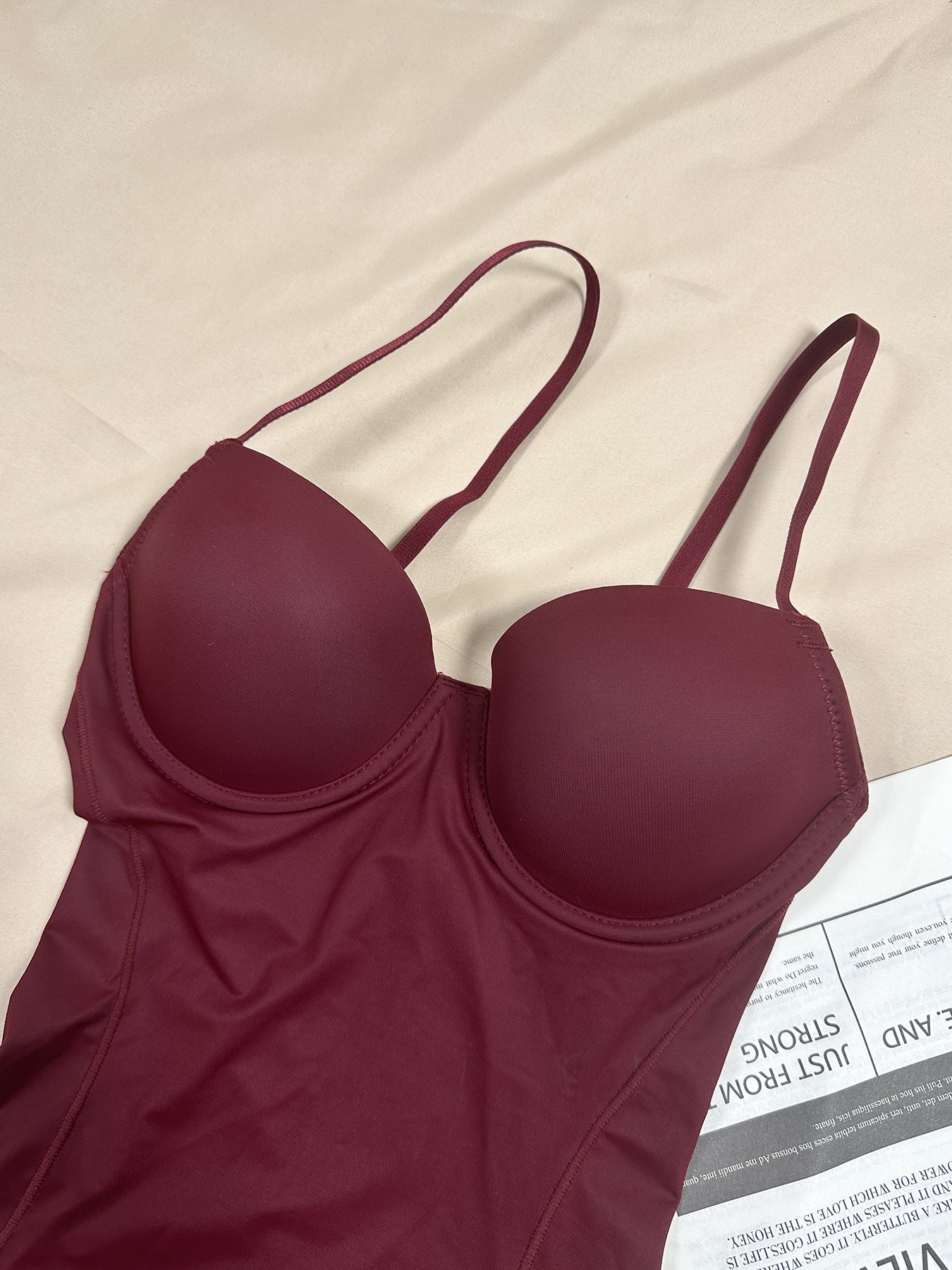 Fashion Couture seamless shapewear bodysuit with built-in bra, tummy control, and butt lift, shown on a mannequin.